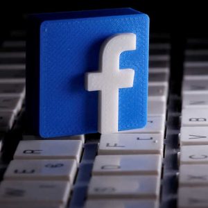 FILE PHOTO: A 3D-printed Facebook logo is seen placed on a keyboard in this illustration taken March 25, 2020. REUTERS/Dado Ruvic/Illustration/File Photo  GLOBAL BUSINESS WEEK AHEAD